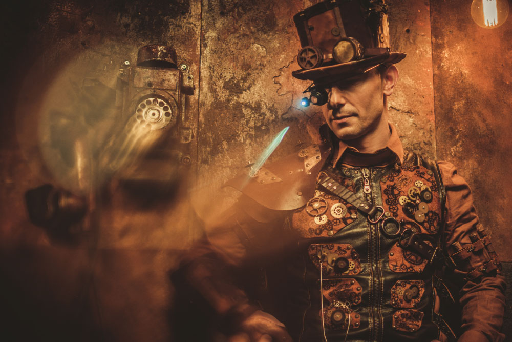 Image: Steampunk Man with various cogs, gears and machines.