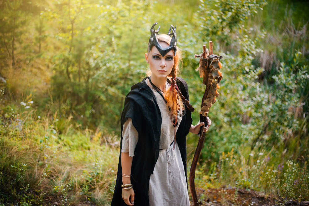 Image: A young druid woman in the forest.