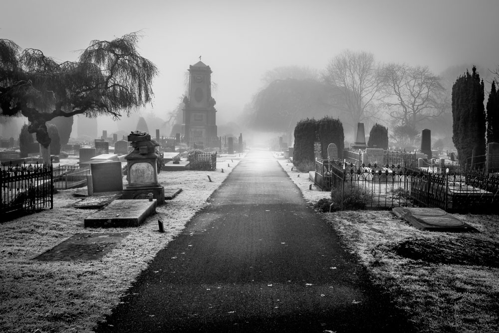 I’m Still Here by Rose Sheehan. Image: An old graveyard in grey skies. 
