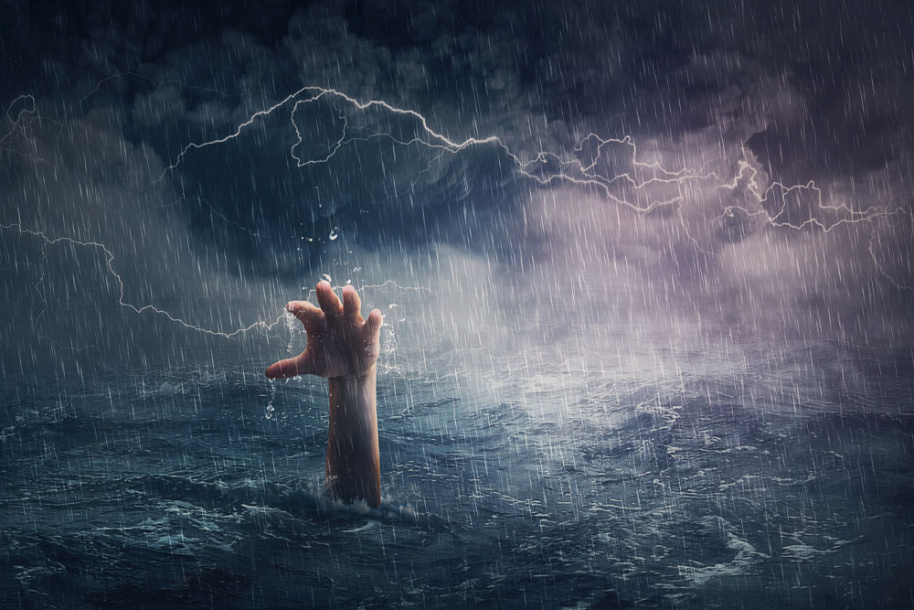 The Metaphor by Isabelle Nicholson. Image: A hand sinking in the ocean in stormy weather.