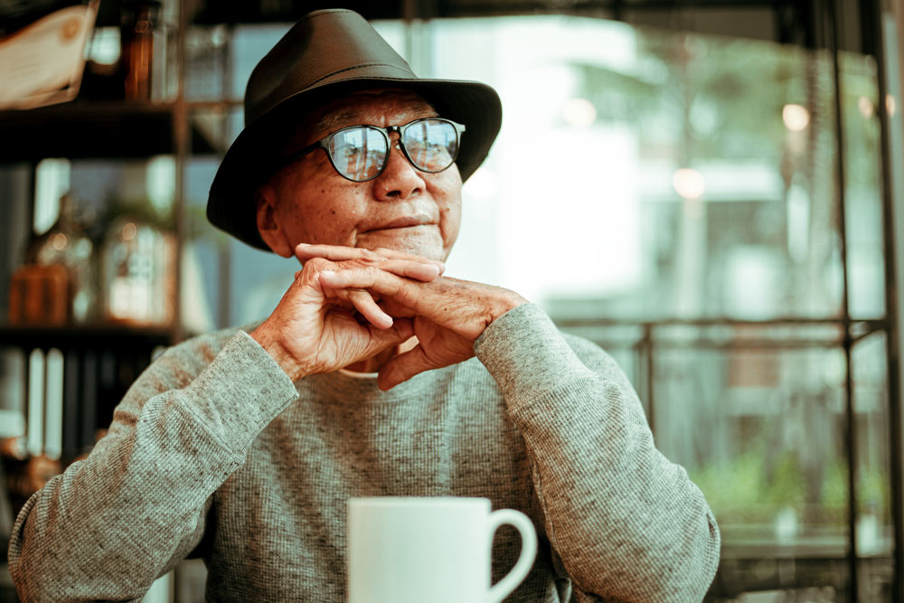 The Funny Guy by Kane Lawson. Image: An elderly man in a cafe. 