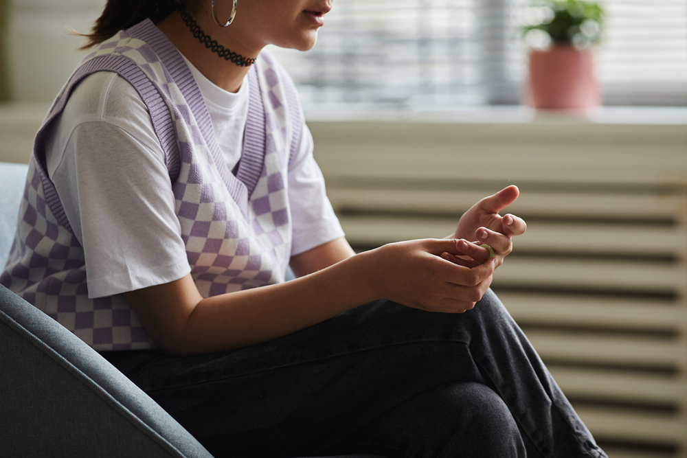 Image: A young woman at a counselling session.